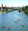 Photo of people canoeing past Concrete Plant Park, courtesy of the Bronx River Alliance