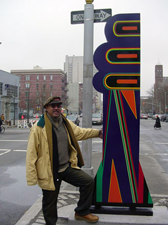 Photo of "Tree of Hope" sculpture and artist Algernon Miller