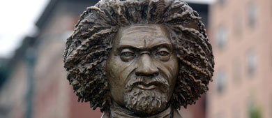 Cropped photo showing the face of a statue of Frederick Douglass