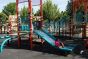 Children Play in Baisley Pond Park Playground