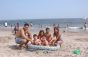 Family with portable pool at the beach