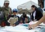 Cutting out a kite at a workshop