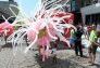 A child inspects a balloon costume by Jason Hackenwerth