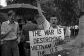 Vietnam War protester carrying sign: 