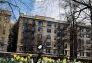 A goose surveys the daffodils at 110th Street & Lenox Avenue