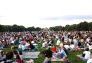 A lawn filled with eager listeners