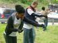 Volunteers sprinkle the lawn